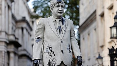 An oil-splattered statue of British Prime Minister Boris Johnson by artist Hugo Farmer installed by Greenpeace activists stands at Downing Street