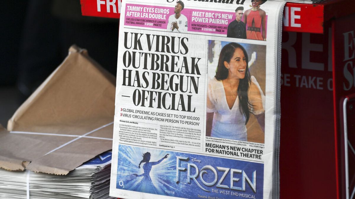 In this Friday, March 6, 2020 file photo, the front page of the Evening Standard is displayed at Bond Street Station, in London.