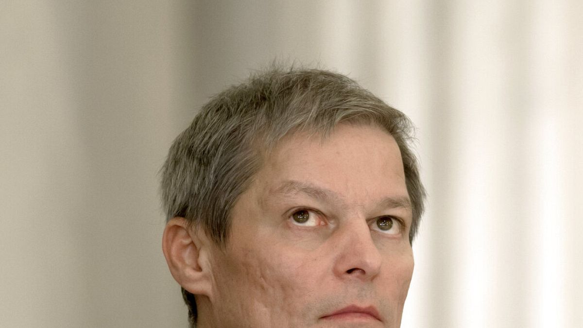 Romania's prime minister Dacian Ciolos looks up during the swearing-in ceremony of the new government in Bucharest, Romania, Tuesday, Nov. 17, 2015