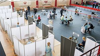 People line up at a local community vaccination centre in Ventspils.