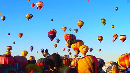 Hundreds of balloons take flight during the Albuquerque International Balloon Fiesta