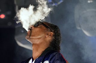 FILE- Snoop Dogg performs a DJ set as "DJ Snoopadelic" during the "Concerts In Your Car" series at the Ventura County Fairgrounds