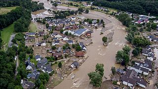 The Ahr river floats past destroyed houses in Insul, Germany after deadly flash floods in Western Europe in July.