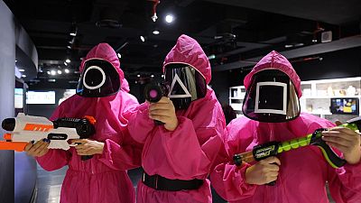 Participants take part in an event where they play the games of Netflix smash hit "Squid Game" at the Korean Cultural Centre in Abu Dhabi, on October 12, 2021.