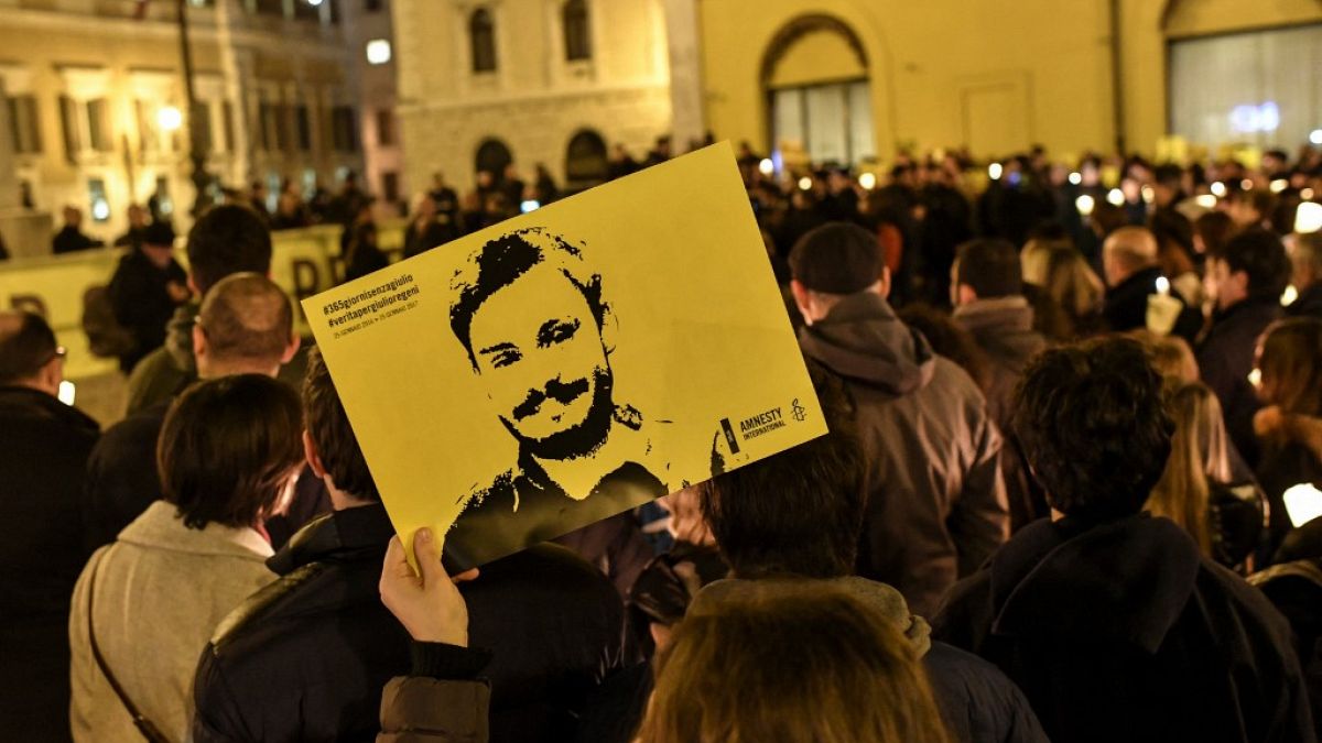Amnesty International activists hold a picture of Giulio Regeni during a demonstration in front of the Italian Parliament in January 2017.