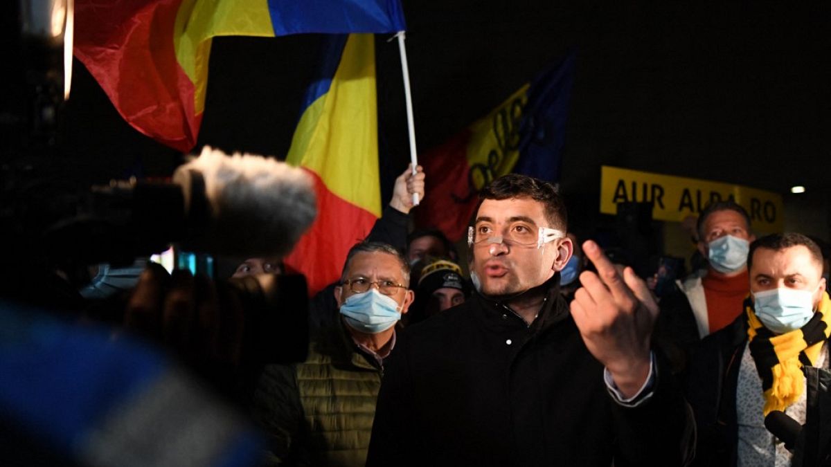 George Simion, the leader and parliament member of nationalist party AUR (The Alliance for the Unity of Romanians) gestures during a protest in Bucharest.