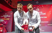 Twins, Garden chefs Ivan and Sergey Berezutsky, who received two Michelin stars, show their award as they take part in the award ceremony, which took place in Moscow.