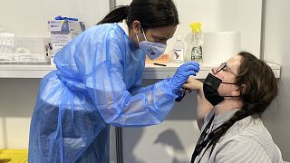 AP photographer Brynn Anderson receives a coronavirus test before resuming work at the Cannes Film Festival on Monday, July 12, 2021, in Cannes, southern France.