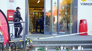 Police at the scene of the Extra store involved in the bow and arrow attack, in Kongsberg, Norway, Friday, Oct. 15, 2021.