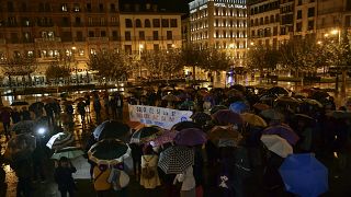 In this Monday, Nov. 4, 2019 file photo, a woman holds a sign that reads: "Only Yes is Yes", as people gather at Plaza del Castillo square in Pamplona, Spain.