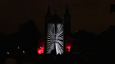 Videomapping show called "The Wind" projected on a Prague church.