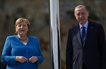 German Chancellor Angela Merkel, left, is welcomed by Turkish President Recep Tayyip Erdogan on the occasion of their meeting at Huber Villa presidential palace, in Istanbul.