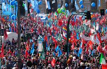 Demonstrators take part in a march organized by Italy's main labour unions, in Rome's St. John Lateran square, Saturday, Oct. 16, 2021