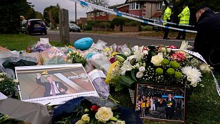 Flowers are laid near the Belfairs Methodist Church in Leigh-on-Sea, Essex, England, 16 Oct 2021, where UK MP Sir David Amess was fatally stabbed.