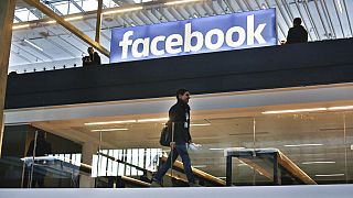 In this Jan.17, 2017 file photo, the Facebook logo is displayed in a start-up companies gathering at Paris' Station F, in Paris.