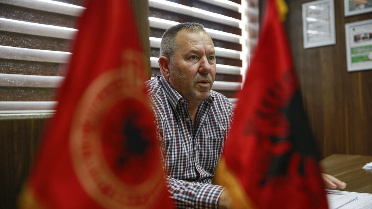 In this Thursday Sept. 24, 2020, file photo Hysni Gucati head of the War Veterans Organization of the Kosovo Liberation Army speaks during an interview with AP.
