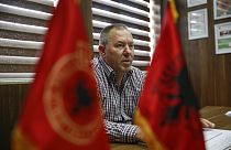 In this Thursday Sept. 24, 2020, file photo Hysni Gucati head of the War Veterans Organization of the Kosovo Liberation Army speaks during an interview with AP.