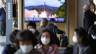 A TV screen showing a news program reporting about North Korea's missile launch with file footage is seen at a train station in Seoul, South Korea, Tuesday, Oct. 19, 2021.