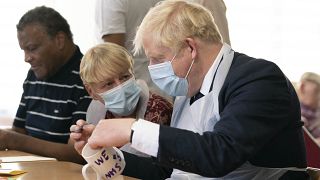 Britain's Prime Minister Boris Johnson during a visit to Westport Care Home in east London on September 7, 2021.