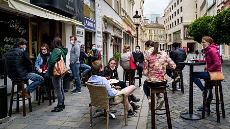 People sitting outside a cafe in Bratislava, Slovakia