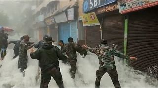 India: Building collapse and rescue operations after deadly floods.