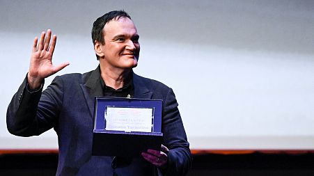 US director Quentin Tarantino acknowledges receiving a Lifetime Achievement Award