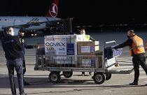 Airport personal unload the first batch of the AstraZeneca vaccines sent from the Covax facility, at Adem Jashari airport Pristina, Kosovo, March 28, 2021.