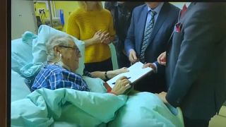 Part of the video showing Zeman in hospital bed signing document convening the new Chamber of Deputies