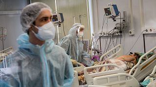 Medical staff treat a COVID-19 patient at an ICU in Infectious Hospital No. 23 in Nizhny Novgorod, Russia
