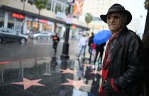 A Freddy Krueger impersonator on the Hollywood Walk Of Fame, situated near the real house