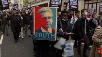 Supporters of WikiLeaks founder Julian Assange march to London's High Court