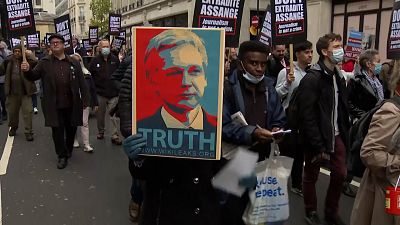 Supporters of WikiLeaks founder Julian Assange march to London's High Court