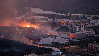Lava flows from a volcano destroying houses at La Laguna neighbourhood on the Canary island of La Palma, Spain on Thursday Oct. 21, 2021.