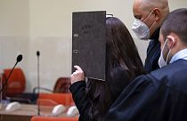 Defendant Jennifer W. arrives in a courtroom for her trial in Munich, Germany, Monday, Oct. 25, 2021.