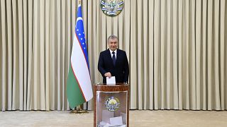 Uzbek President Shavkat Mirziyoyev casts his ballot at a polling station during the presidential election in Tashkent, Uzbekistan, Sunday, Oct. 24, 2021. 