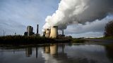 Steam rises from the cooling towers of the coal-fired power station of German energy giant RWE in Weisweiler, western Germany.