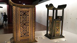The 19th century Throne of King Ghezo, left, and Throne of King Glele, from Benin, are pictured at the Quai Branly–Jacques Chirac museum, Monday, Oct. 25, 2021 in Paris.