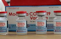 In this Sunday, Aug. 15, 2021 file photo, vials of the Moderna COVID-19 vaccine are seen at the Assad Iben El Fourat school in Oued Ellil, outside Tunis.