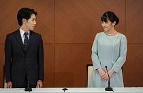 Japan's former Princess Mako and her husband Kei Komuro pose during a press conference to announce their marriage, at a hotel in Tokyo, Japan, Tuesday, Oct. 26, 2021