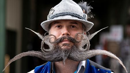 Participant, Christian Feicht from Germany poses at the World Moustache and Beard Championships 2021 in Eging am See, Germany, October 23, 2021.