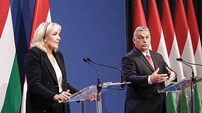 French far-right leader Marine le Pen stands during a joint press conference with Hungarian Prime Minister Viktor Orban in Budapest, Hungary, Tuesday, Oct. 26, 2021.