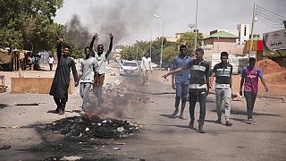 People burn tires during a protest a day after the military seized power Khartoum, Sudan, Tuesday, Oct. 26, 2021. 