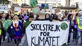 Protesters march during a 'global climate strike' demonstration in Stockholm ahead of COP26 on Friday, October 22