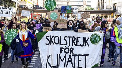 Protesters march during a 'global climate strike' demonstration in Stockholm ahead of COP26 on Friday, October 22