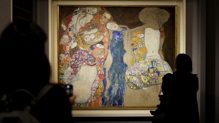 People admire Gustav Klimt's oil on canvas painting "The Bride" (1918) on display at the exhibition "Klimt. The Secession and Italy" at the Museum of Rome