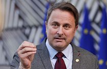 Luxembourg's Prime Minister Xavier Bettel talks to journalists as he arrives for an EU summit in Brussels.