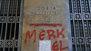 Σύνθημα κατά της Μέρκελ στο κτίριο της Τράπεζας της Ελλάδας την ταραγμένη περίοδο των μνημονίων στην Ελλάδα
