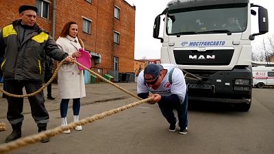 "Russian Hulk" sets world record hauling 53 tonnes of lorry and bus