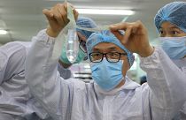 Founder and inventor of Wondaleaf Unisex Condom John Tang Ing Ching inspects the unisex condom at his factory in Sibu, Malaysia October 19, 2021.