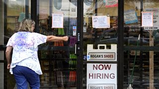 A hiring sign is displayed outside a retail store in Buffalo Grove, Illinois, US, June 24, 2021.